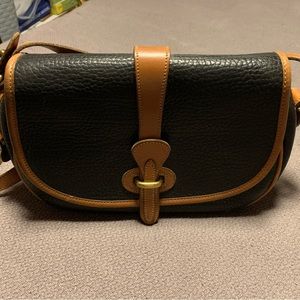 Dooney and Bourke black all weather leather crossbody/shoulder bag.